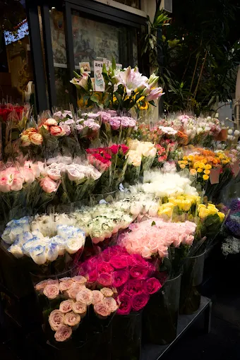 Flower stall filled with roses and lilies